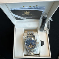 Olevs Mens Luxury Watch Skeleton, Day Date, Silver/Gold Band, Blue Dial