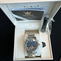 Olevs Mens Luxury Watch Skeleton, Day Date, Silver/Gold Band, Blue Dial