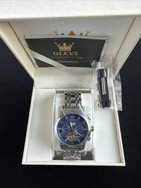 Olevs Men’s Watch Skeleton 5 Hands Silver Band, Blue Dial, Gold Bezel