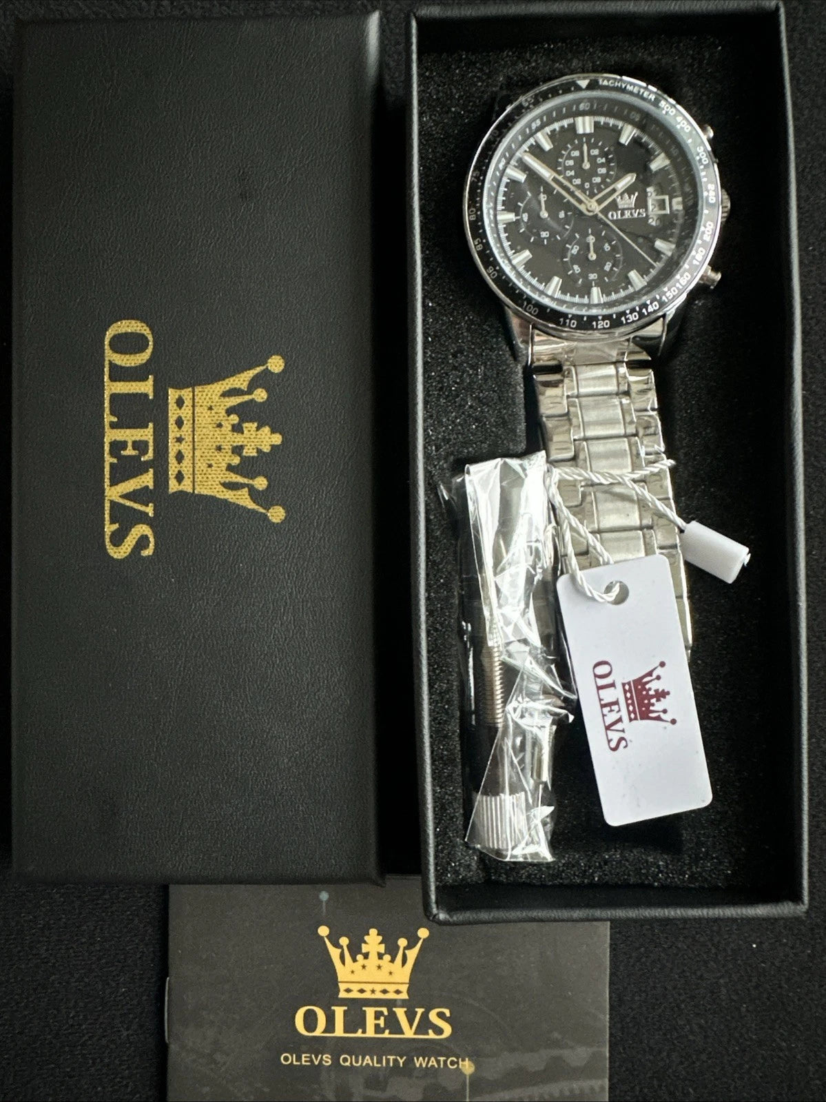 OLEVS Mens Tachymeter Watch Black Face, Silver Band, Day Date, Quartz
